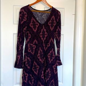 Retro style purple sweater dress with fit and flare sleeves and waist skirt